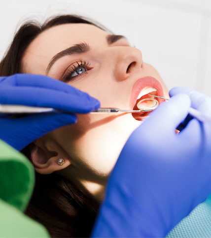 Woman undergoing dental exam