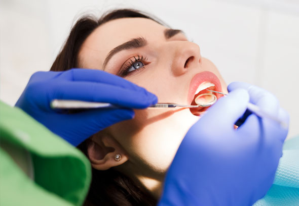 Woman undergoing dental exam